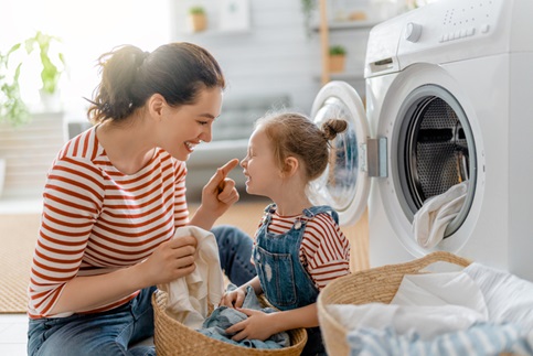 mother and daughter in laundry